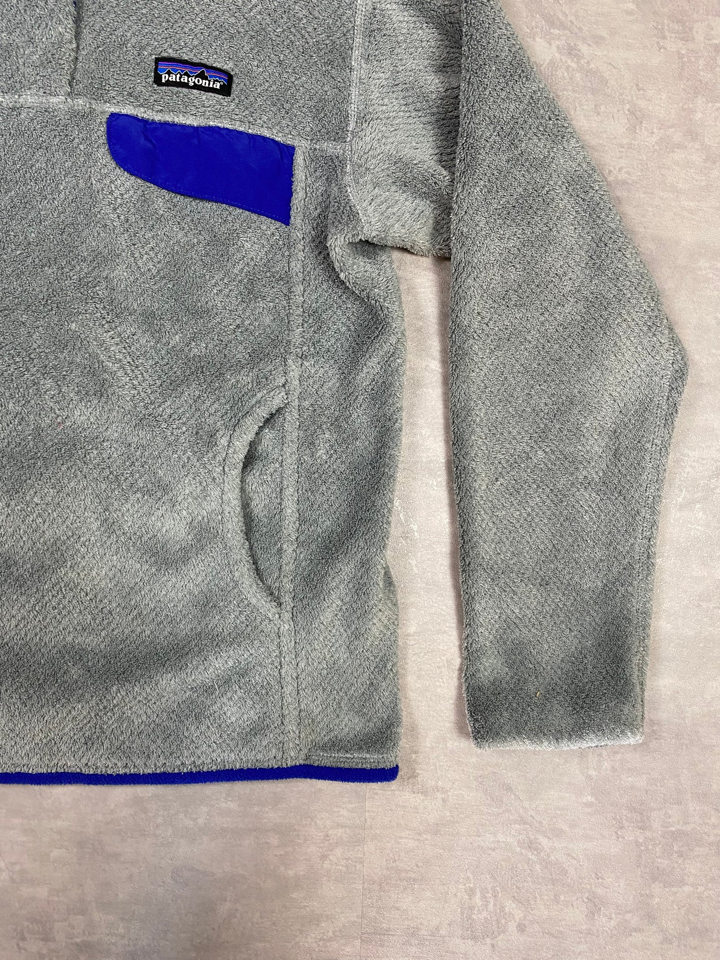 Patagonia fleece front pocket with buttons