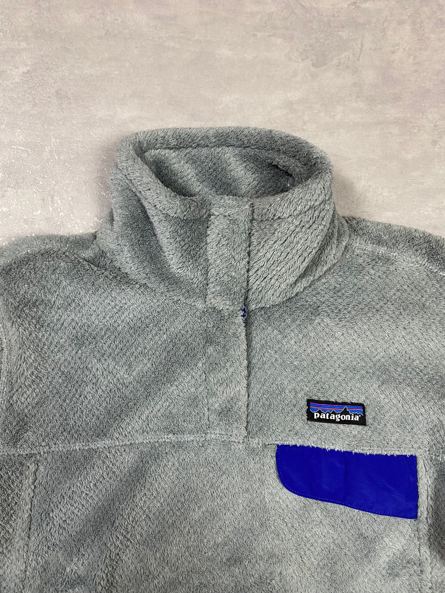 Patagonia fleece front pocket with buttons