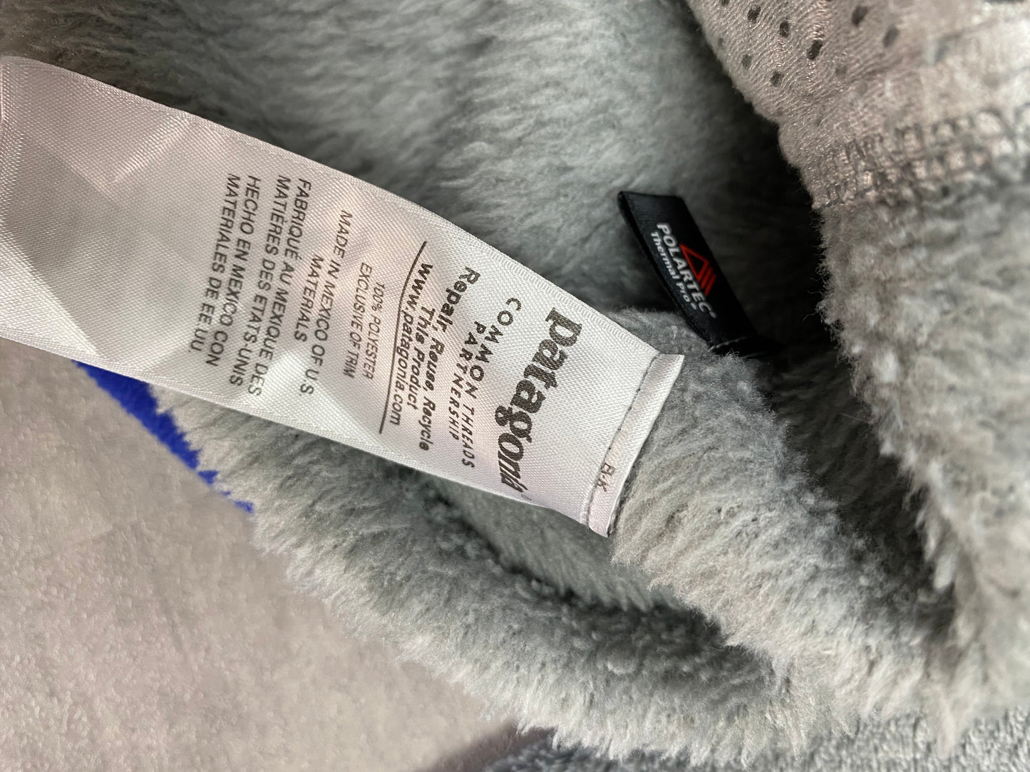 Patagonia fleece front pocket with buttons